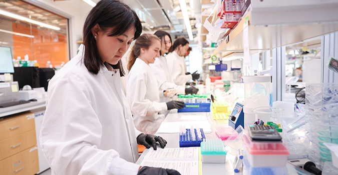 Scientists at NYGC work side by side at a lab bench