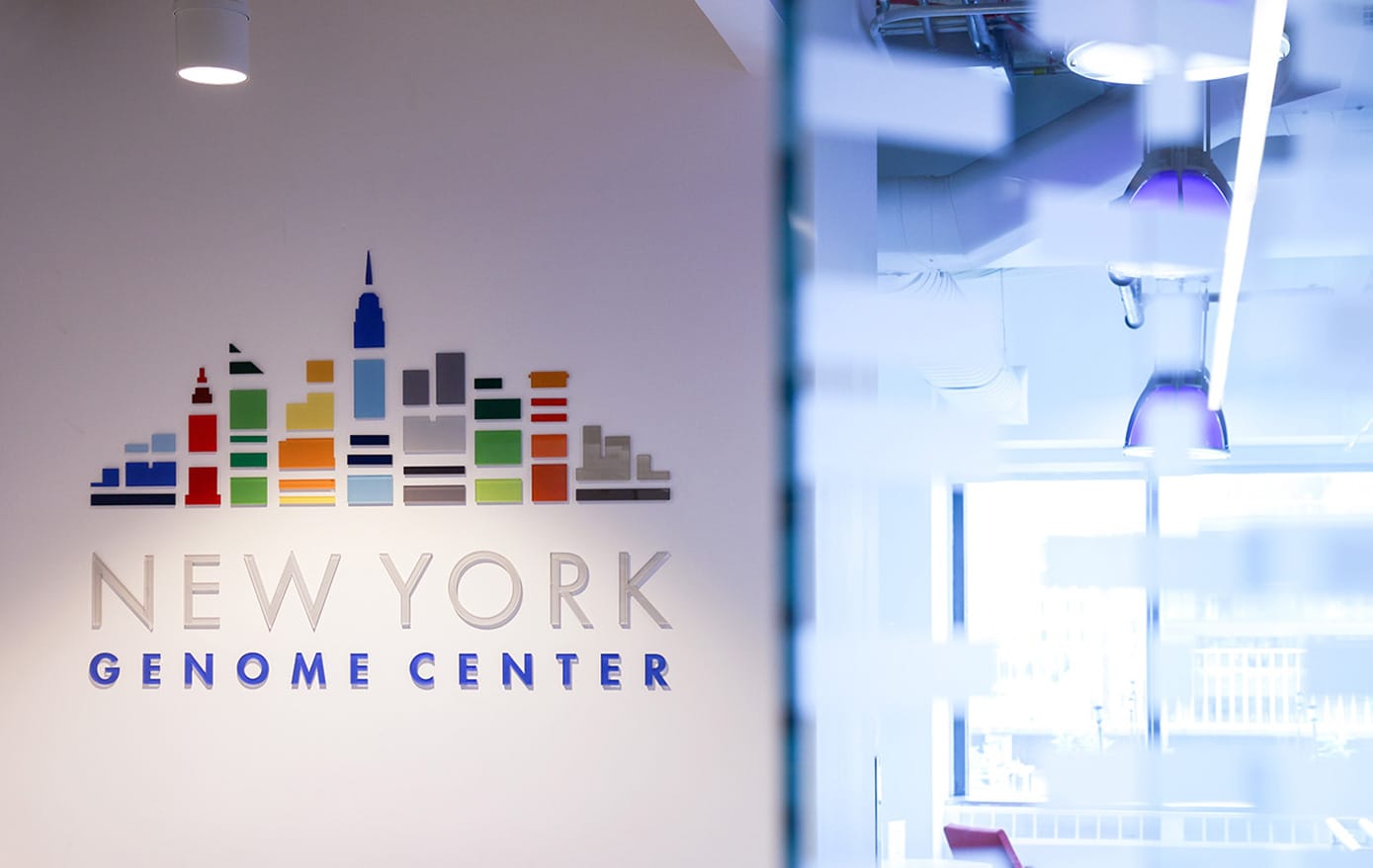 New York Genome Center logo on the wall of the interior space